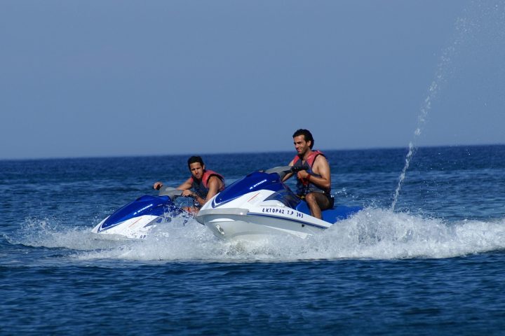 a man riding a wave on top of a body of water