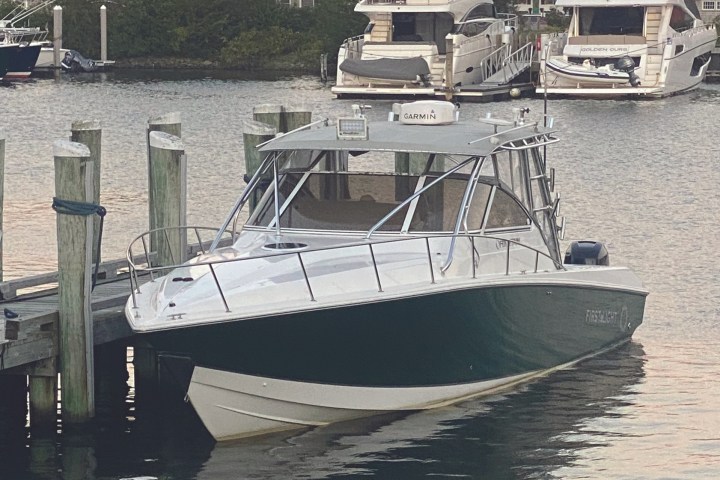 a boat is docked next to a body of water